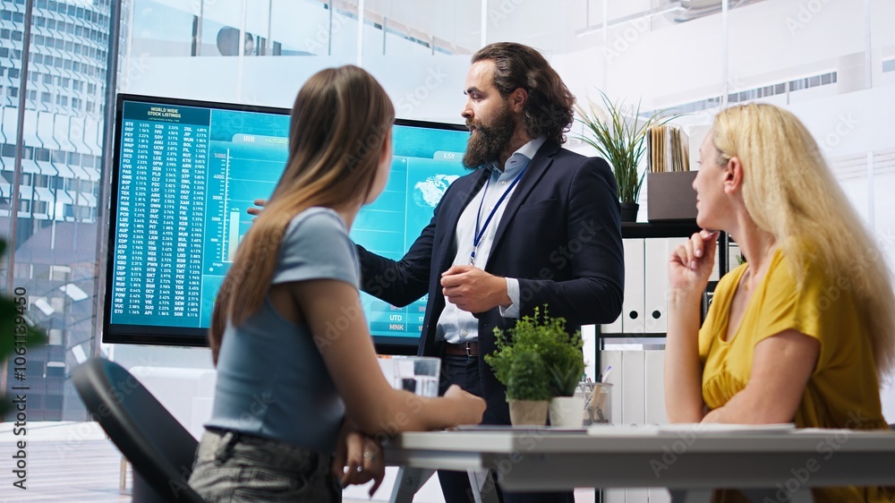 Poster financial adviser presents market analytics to customers using large display, explore best practices