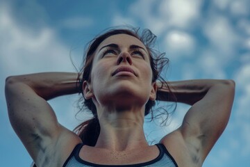 Young female athlete demonstrating her muscular definition, possibly posing for a fitness or health-related article or image.