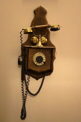Vintage, retro old dial telephone, antique wooden wall phone