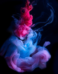 Blue, red, pink abstract cloud of smoke pattern on a black isolated background
