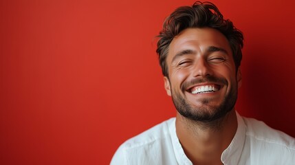 Obraz premium Portrait of a happy handsome man in a shirt with laughing