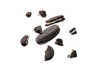 Tasty broken sandwich cookies in air on white background