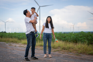 Obraz premium family of three, a man and two children, are standing in a field