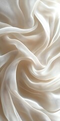 Obraz premium Close-up of delicate, flowing sheer white fabric, highlighting its smooth texture and gentle draping, creating an ethereal and soft ambiance.