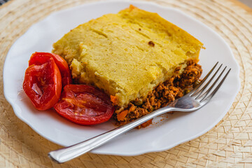 a piece of freshly baked shepherd's pie on a white plate