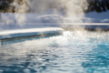 Close-up view of an outdoor hot thermal pool in a winter resort