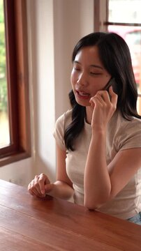 Asian girl talking on her phone