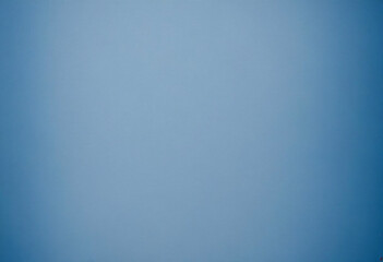A plain blue background with a subtle texture, resembling a soft, muted blue paper or fabric