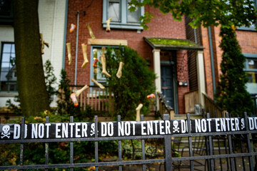 Halloween decorations on the fence of the house.