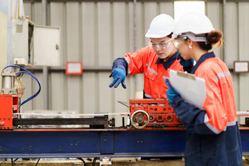 Industrial engineer team works together in factory.