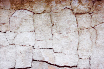Old textured concrete wall with natural defects. Scratches, cracks, crevices. Can be used as background for design or poster.