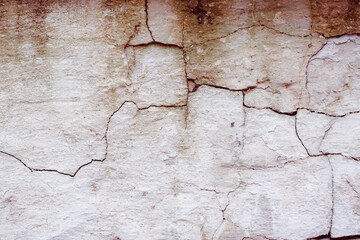 Old textured concrete wall with natural defects. Scratches, cracks, crevices. Can be used as background for design or poster.