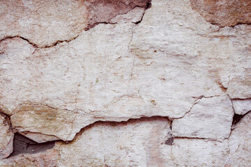 Obraz premium White concrete wall with natural defects. Fragment of the cement surface with natural texture. Monochrome palette of shades.