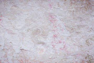 Grey peeling wall with natural defects. Fragment of the concrete shabby surface with natural...