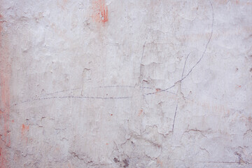 Grey peeling wall with natural defects. Fragment of the concrete shabby surface with natural texture. Red white palette of shades.