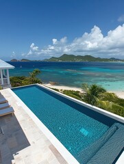 Fototapeta premium Scenic view of a luxury villa with an infinity pool overlooking a tropical coastline.