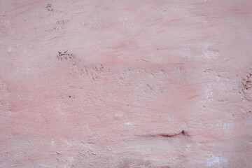 Grunge red concrete background. Textured plaster wall. Color of the year 2025 concept. Top view, layout for design. Surface with peeling shabby pattern.