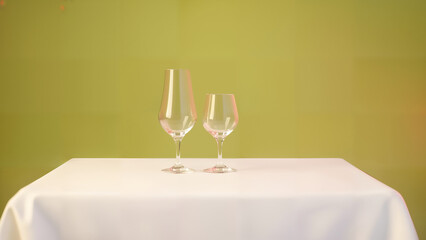 An Elegant White Table Sharing Exquisite Wine Against a Serene Backdrop for an Intimate Gathering