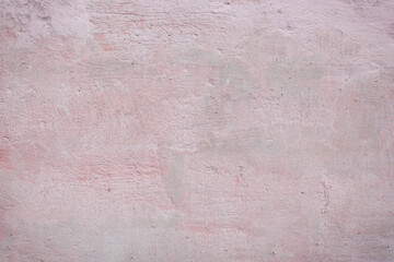 Grunge pink concrete background. Textured plaster wall. Color of the year 2025 concept. Top view, layout for design. Surface with peeling shabby pattern.