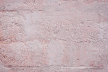 Grunge pink concrete background. Textured plaster wall. Color of the year 2025 concept. Top view, layout for design. Surface with peeling shabby pattern.