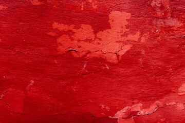 Grunge red concrete background. Textured plaster wall. Color of the year 2025 concept. Top view,...