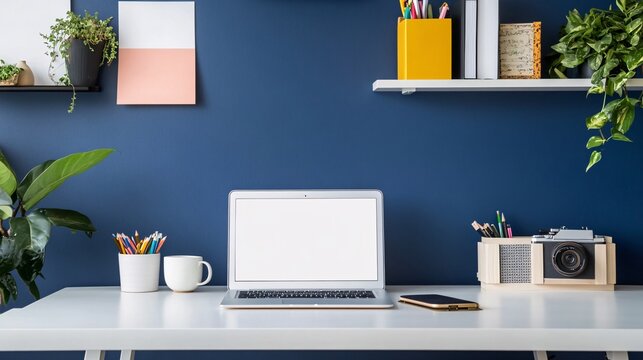 modern home office setup, white desk, open laptop, vintage camera, navy blue accent wall, potted plants, colorful stationery, minimalist shelf, coffee mug, cozy workspace aesthetic