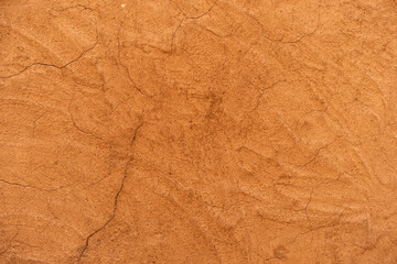 old brown dirty cement wall or ancient city stain yellow paint and cracked concrete golden table top view for empty floor background or retro orange backdrop antique construction to vintage wallpaper