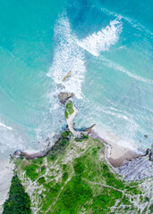 Aerial view of beautiful green rocky islands. Blue ocean coast and wave © Balnyes Visuals