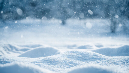 Winter landscape with falling snowflakes and snow drifts. Christmas background with copy space