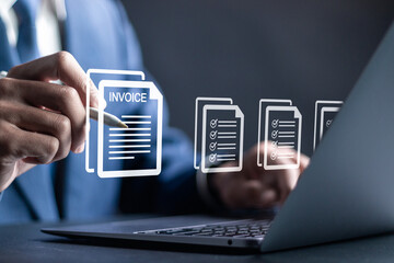 E-invoice and online digital statements concept. digital electronic bill and E-Invoice account. Businessman using laptop to manage invoice documents on virtual screen.