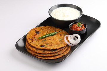   Indian flat bread Methi paratha or Methi thepla is a Indian breakfast dish served with curd and...