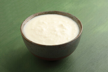 Homemade dahi doi or sour cream or curd or yogurt in a ceramic bowl. Curdled milk. Probiotic food or Probiotic dairy product. It is popular Indian dessert.