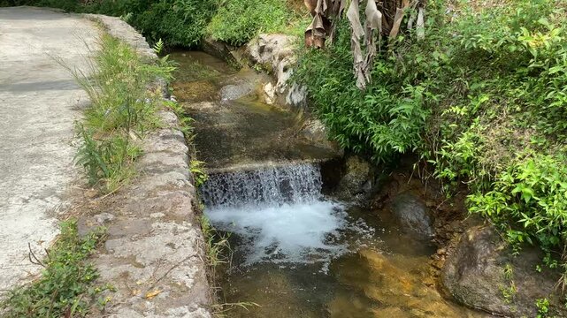 Short waterfall on small river due to height difference