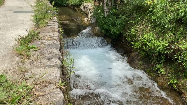 Short waterfall on small river due to height difference