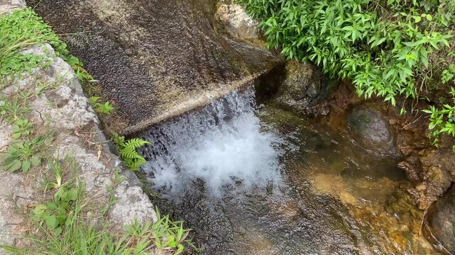 Short waterfall on small river due to height difference
