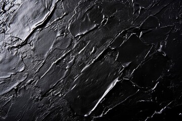 Fototapeta premium Abstract black background with textured paint strokes.