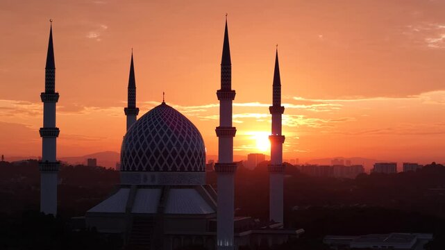malaysian mosque Masjid Sultan Salahuddin Abdul Aziz Shah during beautiful sunrise aerial shot