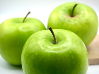 Close up image of green apples on a white background. The Freshness of green apple. An apple has a lot of vitamin C.
