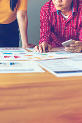 Fototapeta premium Vertical Horizon Close up hands group of Business People meeting in conference room pointing financial document. Vertical business team brainstorming partner teamwork. Close up hand team meeting