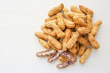 Boiled Peanuts in wooden bowl on white background	