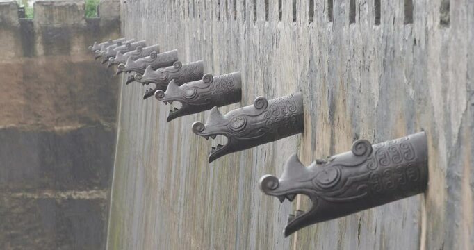 Rain in Forbidden City. Dragon water spout