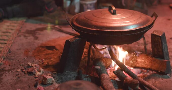 Cooking pot over fireplace in the house. Making food in medieval times