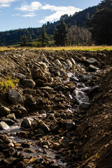 Mini waterfall in summertime rocks