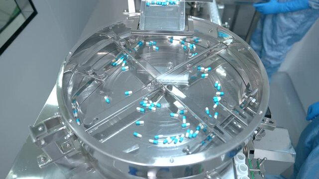 capsule pill making machine. automatic semi machine filling capsule shells. pill making process in a pharma factory. bulk capsule medicine making machine. automatic machine filling capsules pills. pil