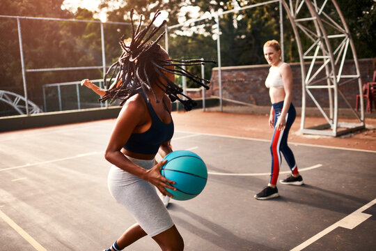 Women, team and ball on basketball court as player or athlete for challenge, cardio and training. Female people, warm up and outdoor for competition, match and sports in physical activity or exercise