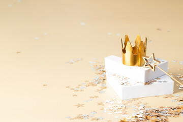 Dia de Reyes Magos day ( Three Wise Men) or Epiphany day, concept. Golden crown on podium with magic star wand and shining confetti background