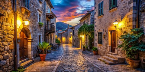 Fototapeta premium Enchanting Night Photography of a Charming Small Street in Montenegro, Europe – Capture the Beauty of Twilight with Cobblestone Paths, Historic Architecture, and Soft Glowing Lights