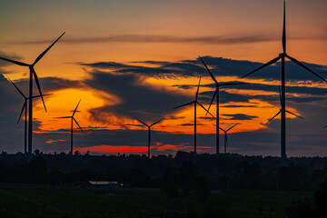 Obraz premium Wind turbine in sunset. renewable energy.renewable energy to businesses, homes, and public buildings.smart city