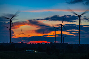 Obraz premium Wind turbine in sunset. renewable energy.renewable energy to businesses, homes, and public buildings.smart city