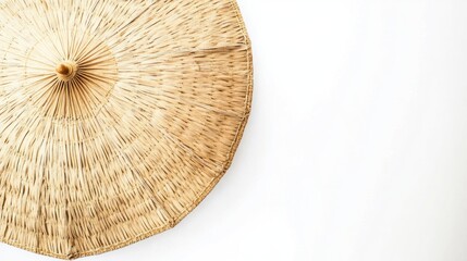 Boho straw beach umbrella with a natural woven texture isolated on clean white